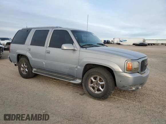 2000 GMC Denali z VIN 1GKEK63R9YR225073, wystawiony jako Copart lot #86819964 z przebiegiem 207 827 mil mil oraz Szkody całkowita. Historia ofert i sprzedaży dostępna na DreamBid. Obrazek 4.