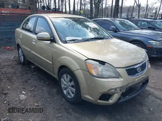2010 Kia Rio LX with VIN KNADH4A35A6629467, listed as a IAAI auction lot 41855387 with 173,077 mi miles. Bid and sale history available at carsss.com. Image 1.