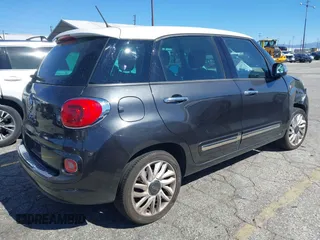 2014 FIAT 500L Lounge with VIN ZFBCFACH1EZ029757, listed as a IAAI auction lot 41643494 with 49,910 mi miles and . Bid and sale history available at DreamBid. Image 4.