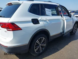 2018 Volkswagen Tiguan SEL z VIN 3VV3B7AX5JM091021, wystawiony jako IAAI lot #42392698 z przebiegiem 107 595 mil mil oraz . Historia ofert i sprzedaży dostępna na DreamBid. Obrazek 13.