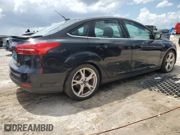 2015 Ford Focus Titanium with VIN 1FADP3J28FL362590, listed as a Copart auction lot 59759495 with 58,644 mi miles and Clean title. Bid and sale history available at DreamBid. Image 3.