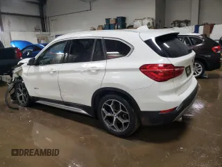 2016 BMW X1 xDrive28i with VIN WBXHT3C3XG5E51117, listed as a Copart auction lot 48243355 with 129,607 mi miles and Salvage Title. Bid and sale history available at carsss.com. Image 2.