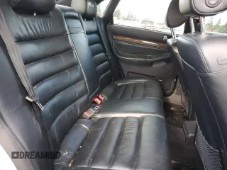 2000 Audi S4 z VIN WAUDD68D7YA179687, wystawiony jako Copart lot #77201694 z przebiegiem 165 118 mil mil oraz Szkody całkowita. Historia ofert i sprzedaży dostępna na DreamBid. Obrazek 10.