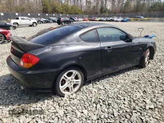 2003 Hyundai Tiburon GT z VIN KMHHN65F13U084620, wystawiony jako Copart lot #46880185 z przebiegiem Nie podano mil oraz Nie do naprawy • Non repairable. Historia ofert i sprzedaży dostępna na DreamBid. Obrazek 3.
