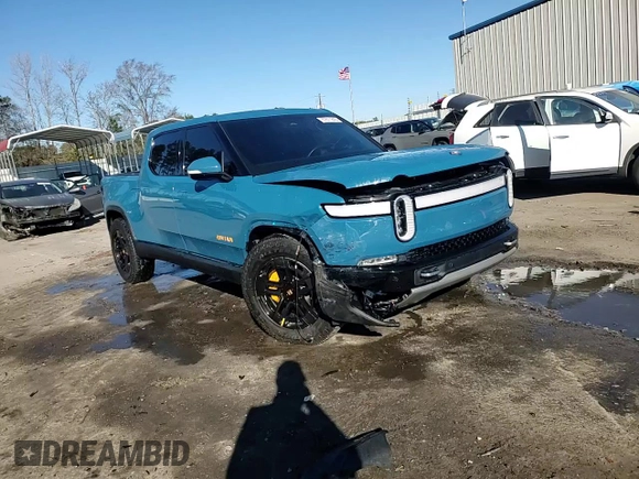2022 Rivian R1T Launch Edition z VIN 7FCTGAAL7NN000539, wystawiony jako Copart lot #87811245 z przebiegiem Nie podano mil oraz Szkody całkowita. Historia ofert i sprzedaży dostępna na DreamBid. Obrazek 14.