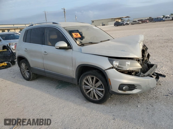 2012 Volkswagen Tiguan SEL with VIN WVGAV7AX2CW529098, listed as a Copart auction lot 53349565 with 128,603 mi miles and Salvage Title. Bid and sale history available at DreamBid. Image 4.