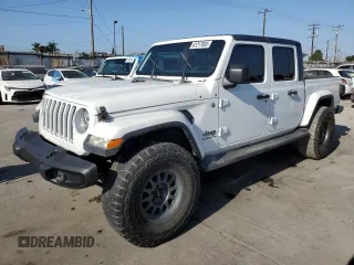2021 Jeep Gladiator High Altitude z VIN 1C6HJTFGXML504007, wystawiony jako Copart lot #61217695 z przebiegiem 70 584 mil mil oraz Szkoda całkowita • Salvage title. Historia ofert i sprzedaży dostępna na DreamBid. Obrazek 1.