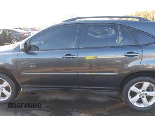 2007 Lexus RX 400h z VIN JTJGW31U772004557, wystawiony jako IAAI lot #41458659 z przebiegiem 193 678 mil mil oraz . Historia ofert i sprzedaży dostępna na DreamBid. Obrazek 14.