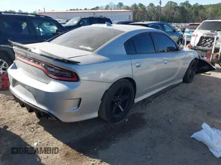 2021 Dodge Charger Scat Pack with VIN 2C3CDXGJ5MH539860, listed as a IAAI auction lot 41683146 with 21,361 mi miles and . Bid and sale history available at DreamBid. Image 4.