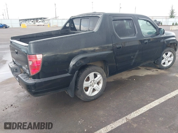 2011 Honda Ridgeline RTL with VIN 5FPYK1F53BB001385, listed as a IAAI auction lot 41945219 with 168,713 mi miles and . Bid and sale history available at DreamBid. Image 4.