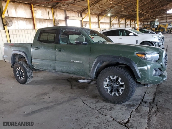2022 Toyota Tacoma 4WD SR with VIN 3TYCZ5AN0NT055986, listed as a Copart auction lot 50165995 with 52,628 mi miles and Salvage Title. Bid and sale history available at carsss.com. Image 4.