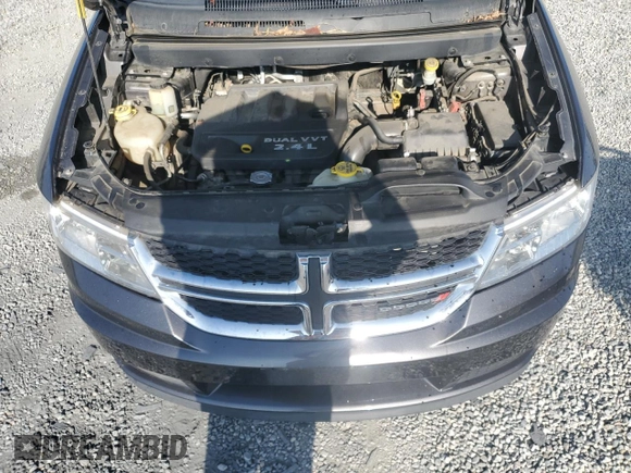 2014 Dodge Journey American Value with VIN 3C4PDCABXET277897, listed as a Copart auction lot 60566735 with 113,343 mi miles and Salvage title. Bid and sale history available at DreamBid. Image 12.