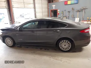 2016 Ford Fusion SE Hybrid with VIN 3FA6P0LU2GR388787, listed as a IAAI auction lot 41733661 with 86,078 mi miles and . Bid and sale history available at DreamBid. Image 14.