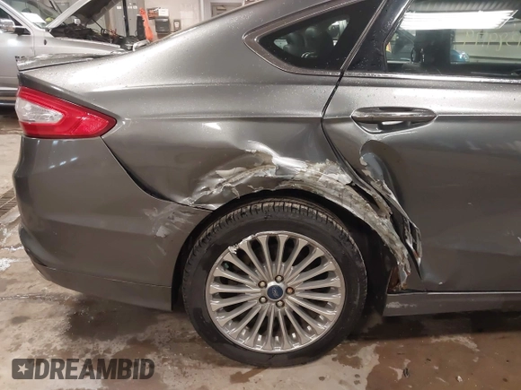 2013 Ford Fusion Titanium Hybrid with VIN 3FA6P0RU6DR319586, listed as a IAAI auction lot 42138979 with 125,388 mi miles. Bid and sale history available at carsss.com. Image 12.