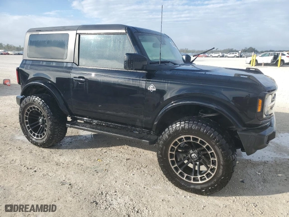 2022 Ford Bronco with VIN 1FMDE5AHXNLB04601, listed as a Copart auction lot 85704284 with 34,708 mi miles and Salvage Title. Bid and sale history available at carsss.com. Image 4.
