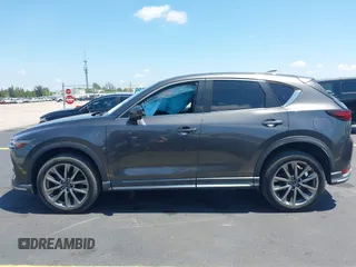 2018 Mazda CX-5 Grand Touring with VIN JM3KFADM8J1310328, listed as a IAAI auction lot 42322780 with 106,378 mi miles and . Bid and sale history available at DreamBid. Image 15.