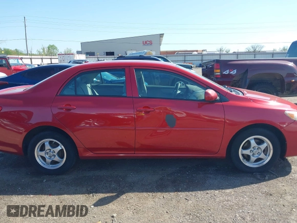 2009 Toyota Corolla with VIN 1NXBU40E99Z122454, listed as a IAAI auction lot 41999898 with 202,958 mi miles. Bid and sale history available at carsss.com. Image 13.