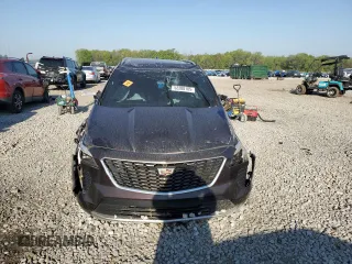 2021 Cadillac XT4 FWD Premium Luxury z VIN 1GYFZCR45MF002654, wystawiony jako Copart lot #52288105 z przebiegiem Nie podano mil oraz Szkody całkowita. Historia ofert i sprzedaży dostępna na DreamBid. Obrazek 5.