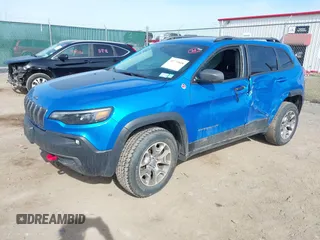 2021 Jeep Cherokee Trailhawk with VIN 1C4PJMBX4MD222987, listed as a IAAI auction lot 41771808 with 52,533 mi miles and . Bid and sale history available at DreamBid. Image 2.