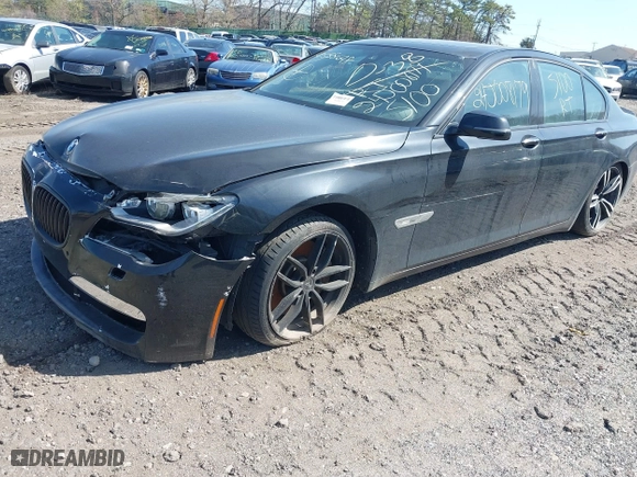 2015 BMW 7 Series 750i xDrive with VIN WBAYB6C57FD965802, listed as a IAAI auction lot 40588698 with 999,999 mi miles. Bid and sale history available at carsss.com. Image 2.