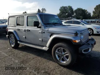2019 Jeep Wrangler Unlimited Sahara with VIN 1C4HJXEN0KW616942, listed as a Copart auction lot 63501755 with 57,095 mi miles and Salvage title. Bid and sale history available at DreamBid. Image 4.