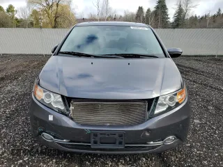 2014 Honda Odyssey Touring z VIN 5FNRL5H98EB512144, wystawiony jako Copart lot #69987533 z przebiegiem 184 231 mil mil oraz Szkoda całkowita • Salvage title. Historia ofert i sprzedaży dostępna na DreamBid. Obrazek 5.