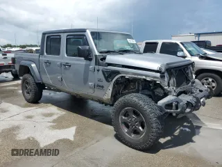 2020 Jeep Gladiator Sport S with VIN 1C6JJTAG9LL149872, listed as a Copart auction lot 58518095 with 118,910 mi miles and Salvage title. Bid and sale history available at DreamBid. Image 4.