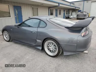 1996 Toyota Supra с VIN JZA800034162, выставлен на аукционе Copart как лот 80046394 с пробегом 86 285 миль миль и Чистый • Clean title. История ставок и продаж доступна на DreamBid. Изображение 2.