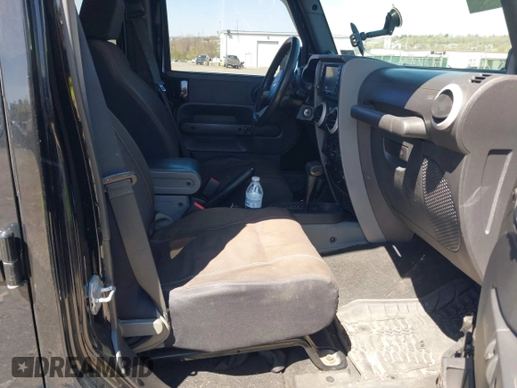 2010 Jeep Wrangler Unlimited Sahara with VIN 1J4HA5H17AL140941, listed as a IAAI auction lot 42004203 with 126,100 mi miles. Bid and sale history available at carsss.com. Image 5.