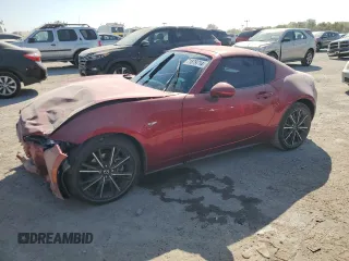 2024 Mazda MX-5 Miata Grand Touring z VIN JM1NDAM75R0603367, wystawiony jako Copart lot #71879714 z przebiegiem 9 108 mil mil oraz Szkoda całkowita • Salvage title. Historia ofert i sprzedaży dostępna na DreamBid. Obrazek 1.
