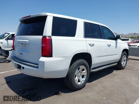 2015 Chevrolet Tahoe Commercial with VIN 1GNSK3EC9FR622941, listed as a IAAI auction lot 42592315 with 239,334 mi miles and . Bid and sale history available at DreamBid. Image 4.