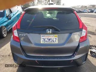 2015 Honda Fit LX z VIN 3HGGK5H51FM774707, wystawiony jako IAAI lot #42228746 z przebiegiem 238 489 mil mil oraz . Historia ofert i sprzedaży dostępna na DreamBid. Obrazek 17.