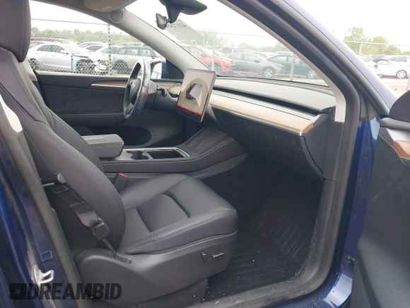 2023 Tesla Model Y Long Range z VIN 7SAYGDEE0PF840787, wystawiony jako IAAI lot #42172489 z przebiegiem 16 314 mil mil oraz . Historia ofert i sprzedaży dostępna na DreamBid. Obrazek 5.