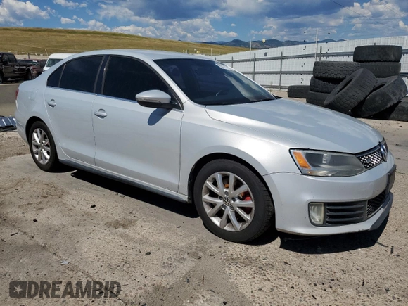 2012 Volkswagen Jetta PZEV with VIN 3VW4A7AJXCM123009, listed as a Copart auction lot 63573145 with 242,860 mi miles and Clean title. Bid and sale history available at DreamBid. Image 4.