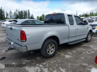 2002 Ford F-150 z VIN 2FTRX17L42CA98695, wystawiony jako IAAI lot #42154232 z przebiegiem 180 924 mil mil oraz . Historia ofert i sprzedaży dostępna na DreamBid. Obrazek 4.