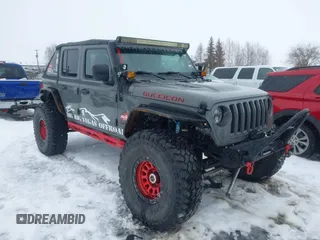 2020 Jeep Wrangler Unlimited Rubicon z VIN 1C4HJXFNXLW152641, wystawiony jako IAAI lot #41906850 z przebiegiem 40 484 mil mil oraz . Historia ofert i sprzedaży dostępna na DreamBid. Obrazek 1.