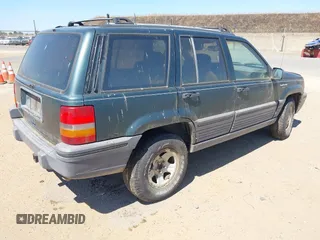 1994 Jeep Grand Cherokee Laredo with VIN 1J4GZ58S2RC118502, listed as a IAAI auction lot 42701778 with 420,559 mi miles and . Bid and sale history available at DreamBid. Image 4.