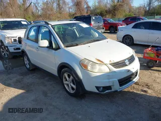 2007 Suzuki SX4 Man Touring Pkg AWD with VIN JS2YB417075101171, listed as a IAAI auction lot 41982543 with 124,205 mi miles. Bid and sale history available at carsss.com. Image 1.