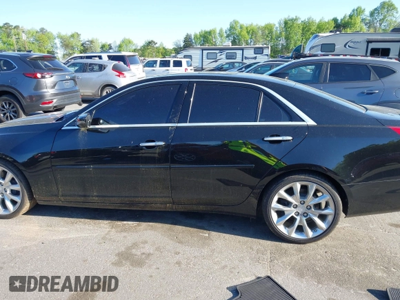 2015 Cadillac CTS Premium AWD with VIN 1G6AZ5S35F0129572, listed as a IAAI auction lot 42045670 with 62,758 mi miles and . Bid and sale history available at DreamBid. Image 14.