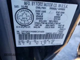 1999 Ford F-350 XL z VIN 1FTSX31F0XEC31633, wystawiony jako Copart lot #84082754 z przebiegiem 192 085 mil mil oraz Szkoda całkowita • Salvage title. Historia ofert i sprzedaży dostępna na DreamBid. Obrazek 13.