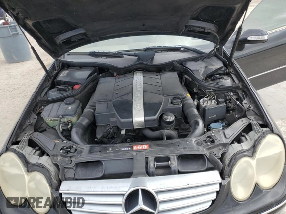 2005 Mercedes-Benz CLK 320 z VIN WDBTJ65J55F157718, wystawiony jako Copart lot #45033595 z przebiegiem 153 639 mil mil oraz Szkody całkowita. Historia ofert i sprzedaży dostępna na DreamBid. Obrazek 13.