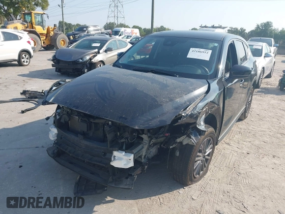 2020 Mazda CX-5 Touring with VIN JM3KFACM2L0770241, listed as a IAAI auction lot 42186952 with 41,590 mi miles and . Bid and sale history available at DreamBid. Image 6.
