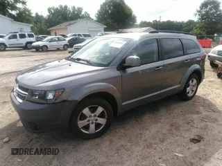 2012 Dodge Journey SXT with VIN 3C4PDCBG9CT153241, listed as a IAAI auction lot 42640265 with 184,719 mi miles and . Bid and sale history available at DreamBid. Image 2.