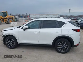 2018 Mazda CX-5 Touring z VIN JM3KFBCM6J0323107, wystawiony jako IAAI lot #41895519 z przebiegiem 86 124 mil mil oraz . Historia ofert i sprzedaży dostępna na DreamBid. Obrazek 14.