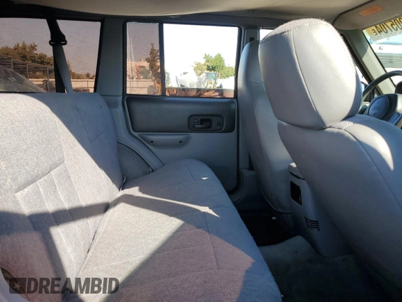 1998 Jeep Cherokee Sport with VIN 1J4FT68S8WL134461, listed as a Copart auction lot 74005704 with 0 mi miles and Salvage Title. Bid and sale history available at carsss.com. Image 10.
