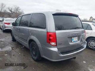 2014 Dodge Grand Caravan American Value with VIN 2C4RDGBG9ER187198, listed as a IAAI auction lot 41669334 with 204,803 mi miles and . Bid and sale history available at DreamBid. Image 3.