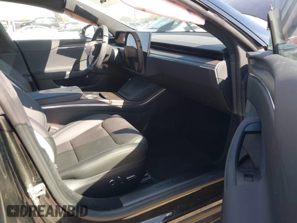 2023 Tesla Model S with VIN 5YJSA1E54PF531021, listed as a IAAI auction lot 42014104 with Not provided miles and . Bid and sale history available at DreamBid. Image 5.