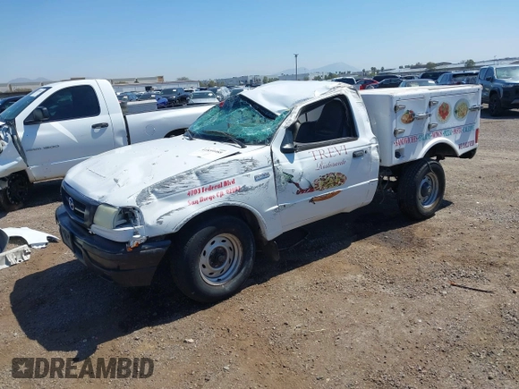 2002 Mazda B-Series Truck SX with VIN 4F4YR12D42TM16317, listed as a IAAI auction lot 41859988 with 220,933 mi miles and . Bid and sale history available at DreamBid. Image 2.