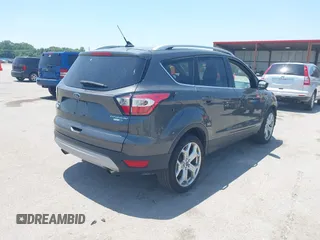 2018 Ford Escape Titanium with VIN 1FMCU9J99JUD43804, listed as a IAAI auction lot 41101250 with 56,438 mi miles and . Bid and sale history available at DreamBid. Image 4.