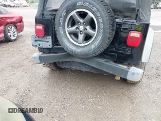 2004 Jeep Wrangler X z VIN 1J4FA39SX4P730504, wystawiony jako IAAI lot #42342491 z przebiegiem 112 942 mil mil oraz . Historia ofert i sprzedaży dostępna na DreamBid. Obrazek 6.